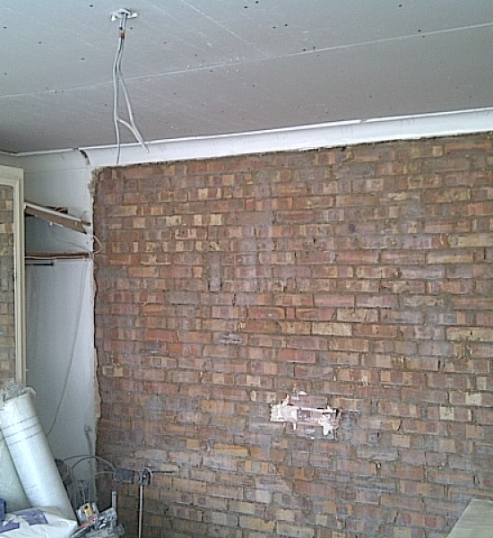 Blown plaster is removed and wall is PVAed