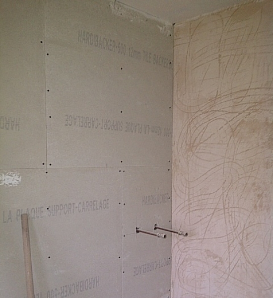Aqua board is fitted onto to studwall
